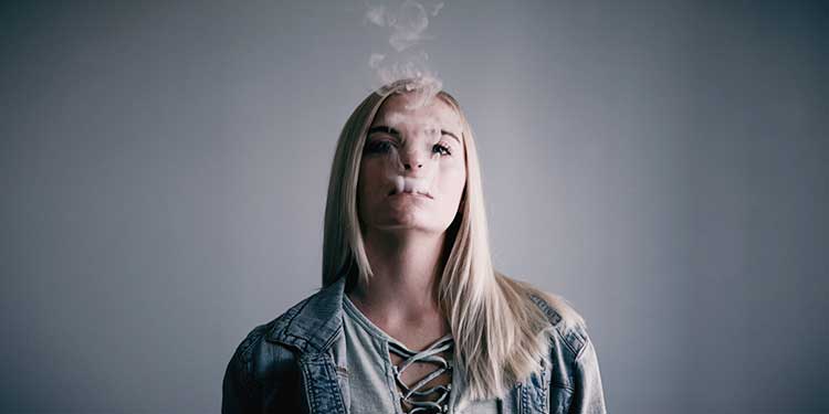 Image of a girl vaping.